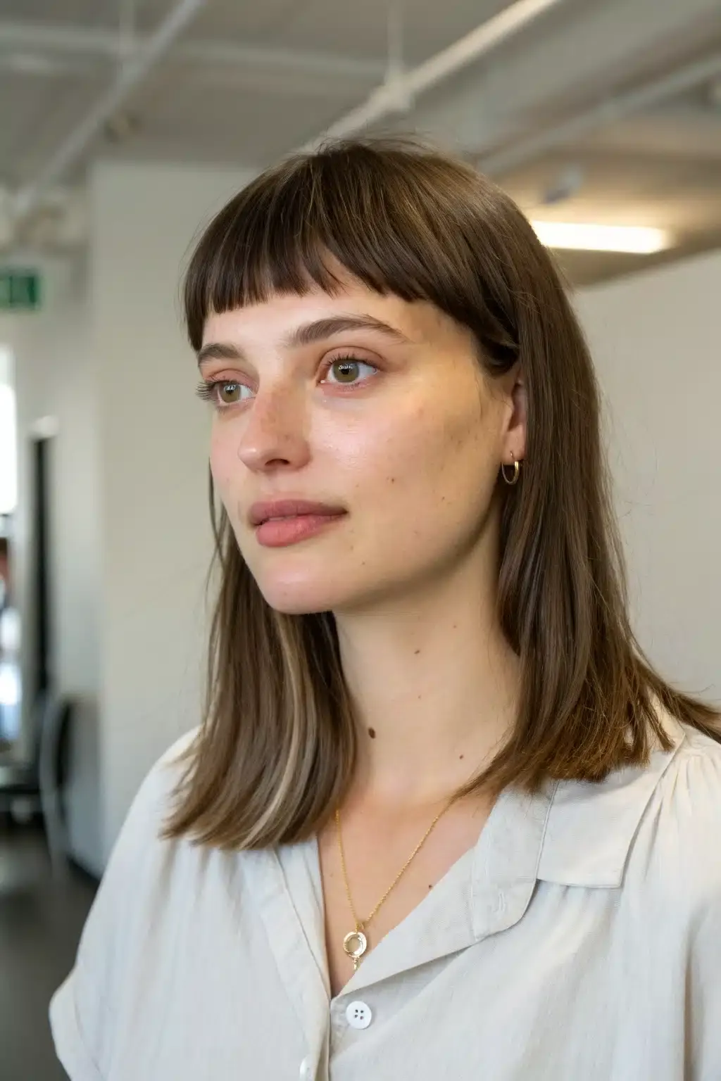17) Blunt bangs with straight hair