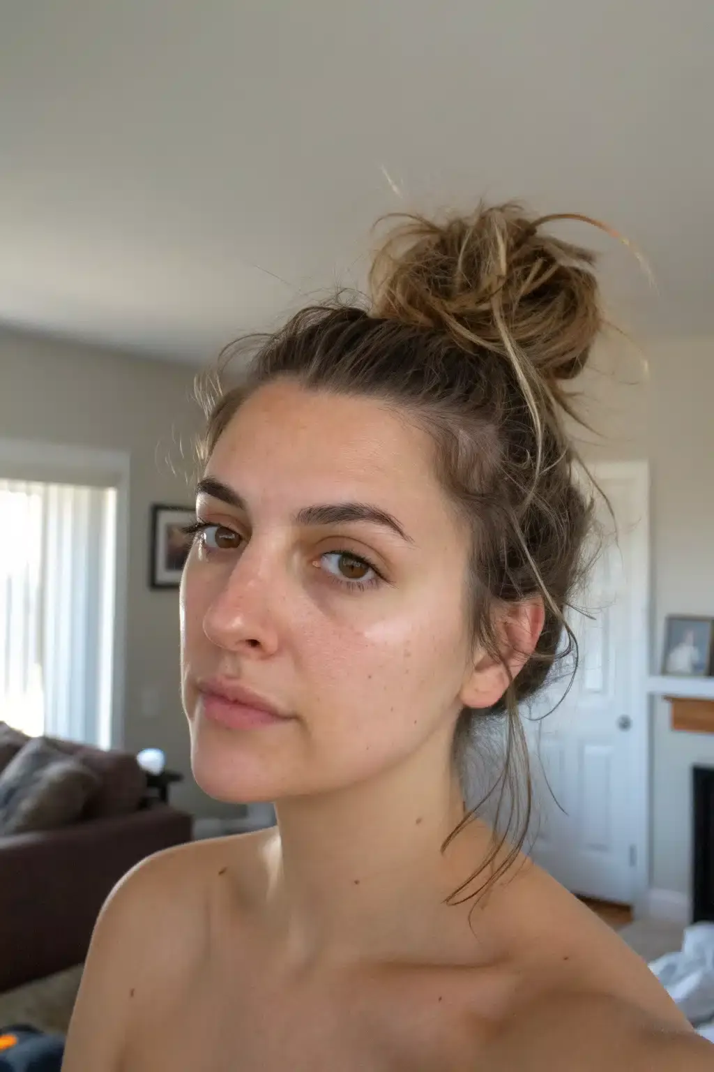 15) Messy Bun with Wispy Strands