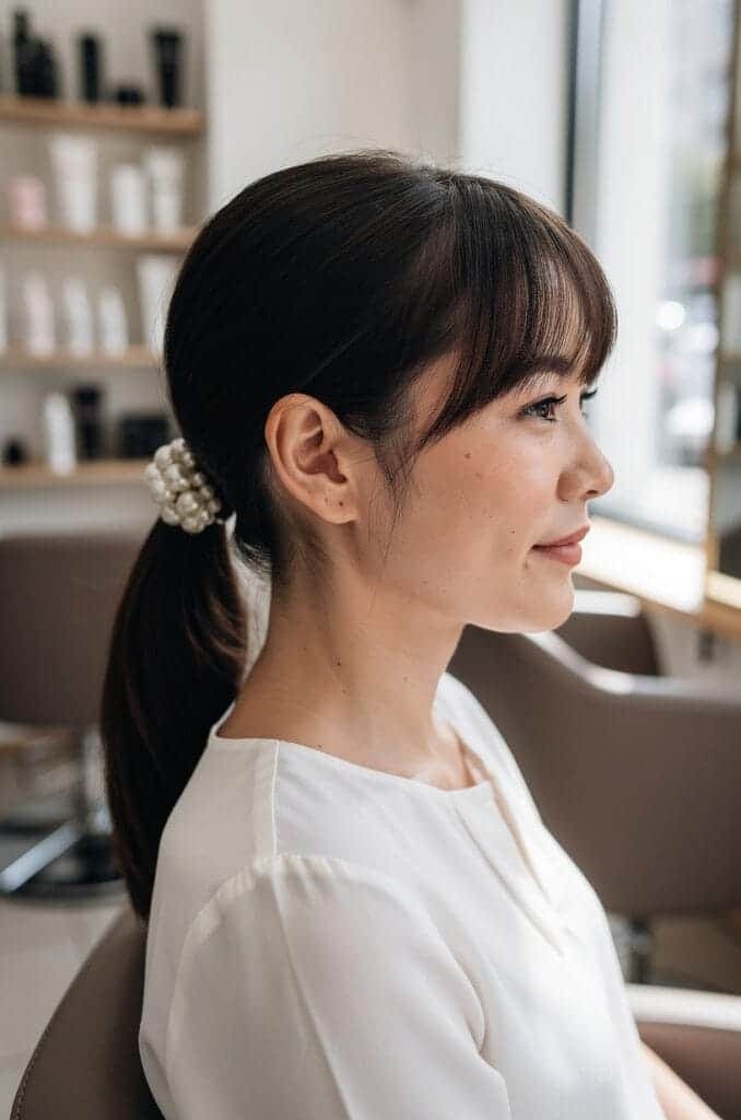 Ponytail with Bangs and a Pearl Clip