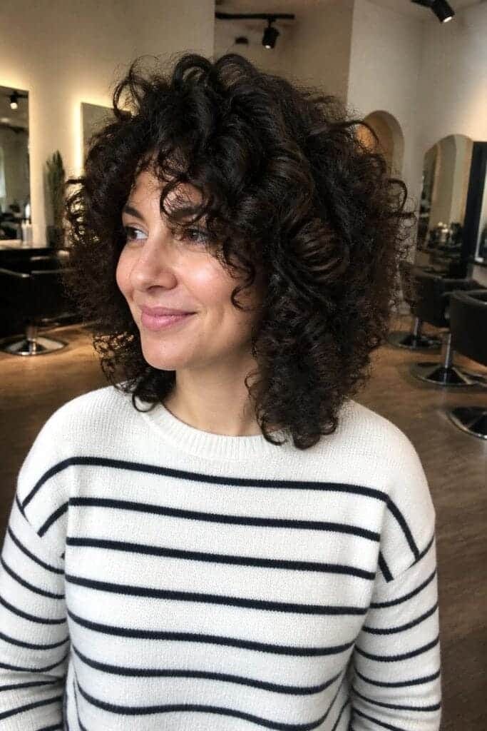 Shoulder-Length Curly Cut with Rounded Layers