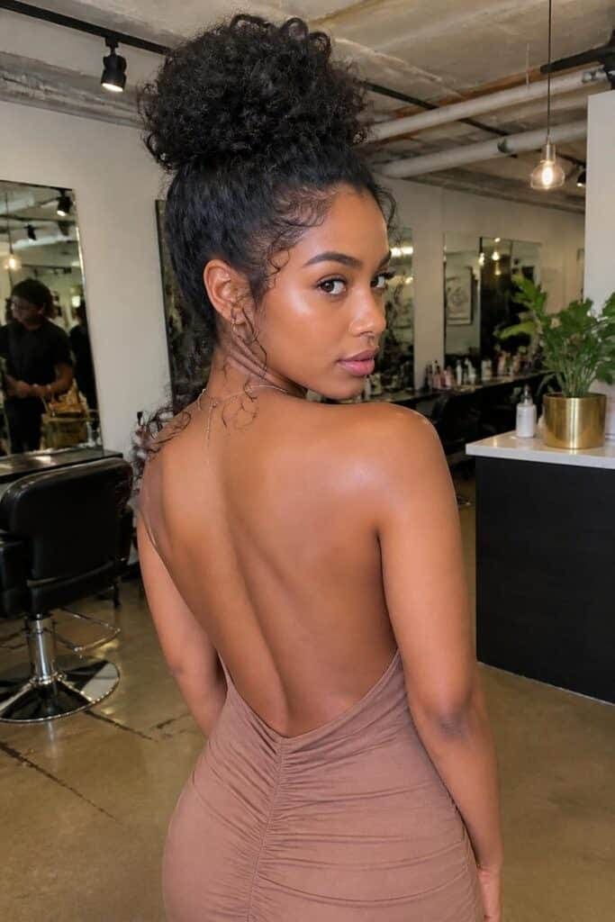 Curly High Bun with Tendrils