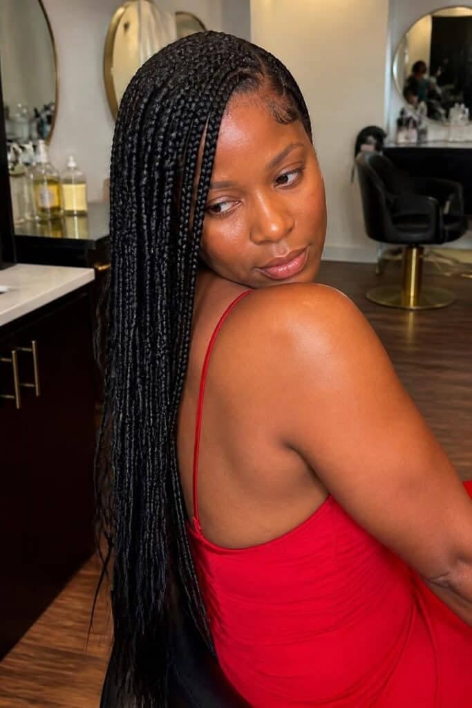Knotless Box Braids with a Side Part and Deep Side Sweep