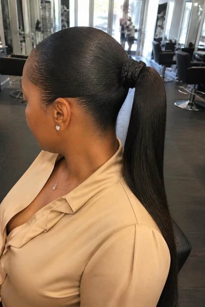 Sleek Ponytail with Braided Wrap