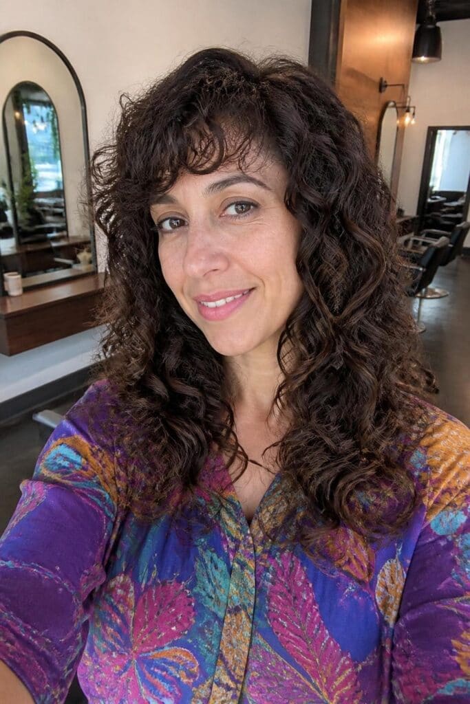 Long Layers with Side Bangs for Curly Hair