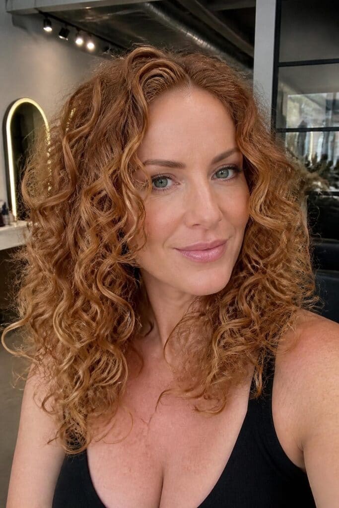 Dimensional Blonde Highlights for Curly Ginger Hair