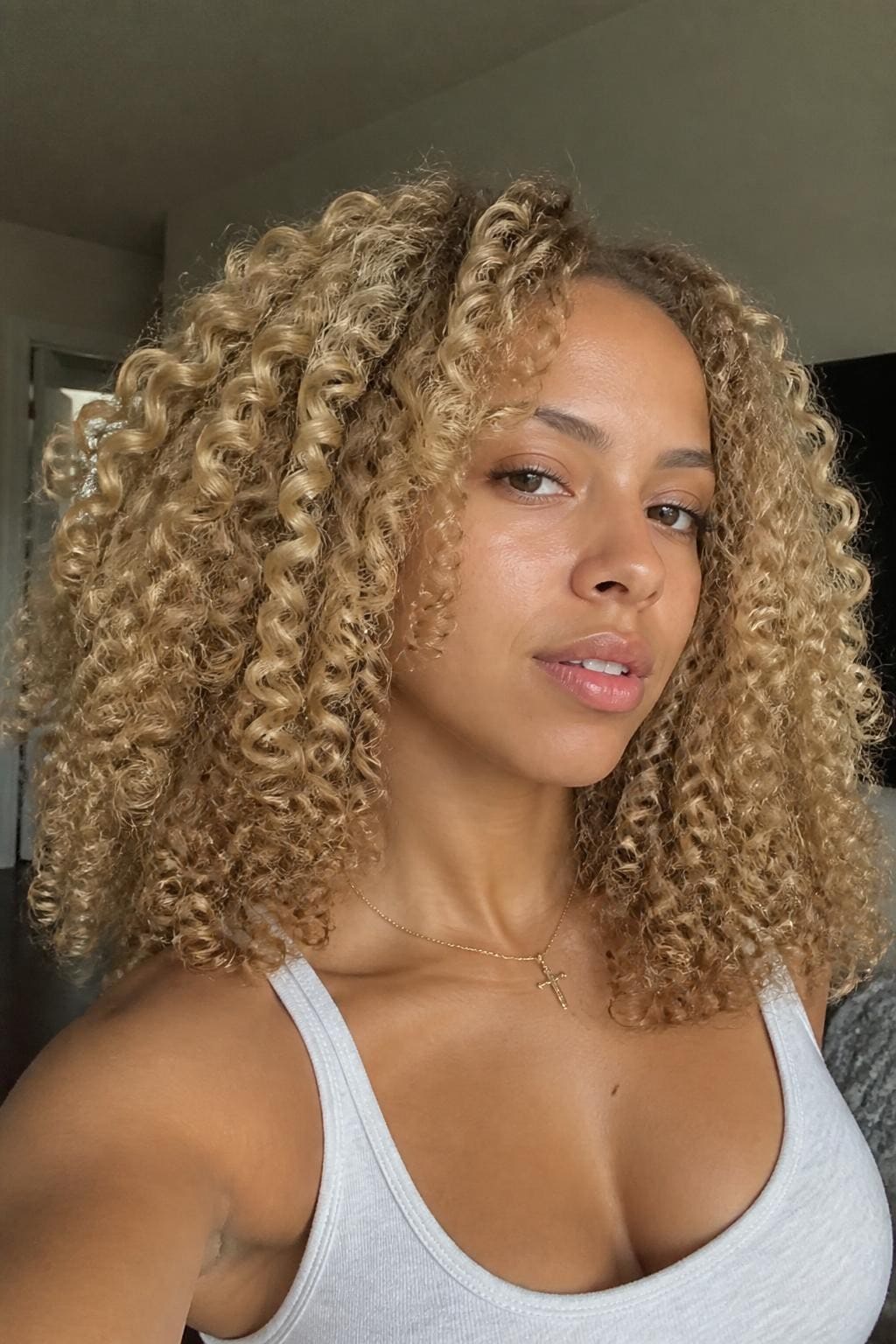 Woman with honey blonde wash-and-go curls